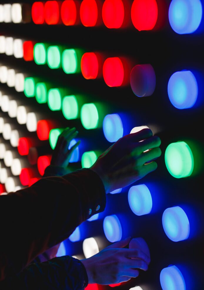 Hands selecting colored lights