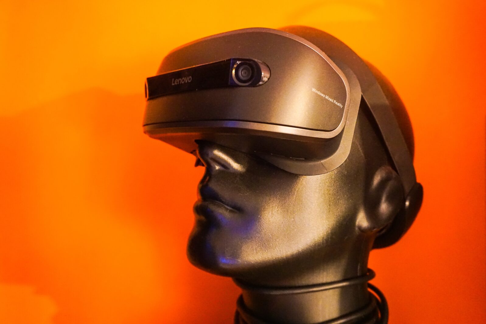 Bronzed person wearing virtual reality glasses