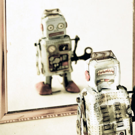 Toy Robot looking at itself in mirror