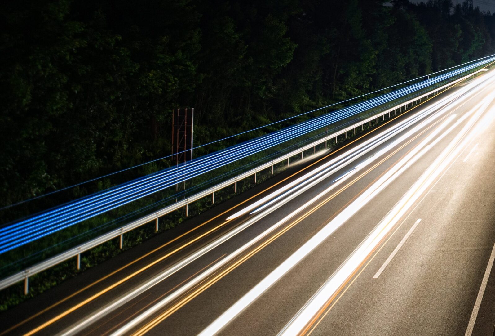 Light streak from vehicles on road at night