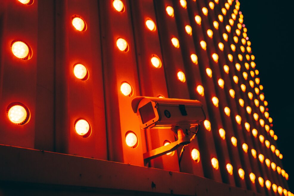 Surveillance CCTV camera with marquee lights behind