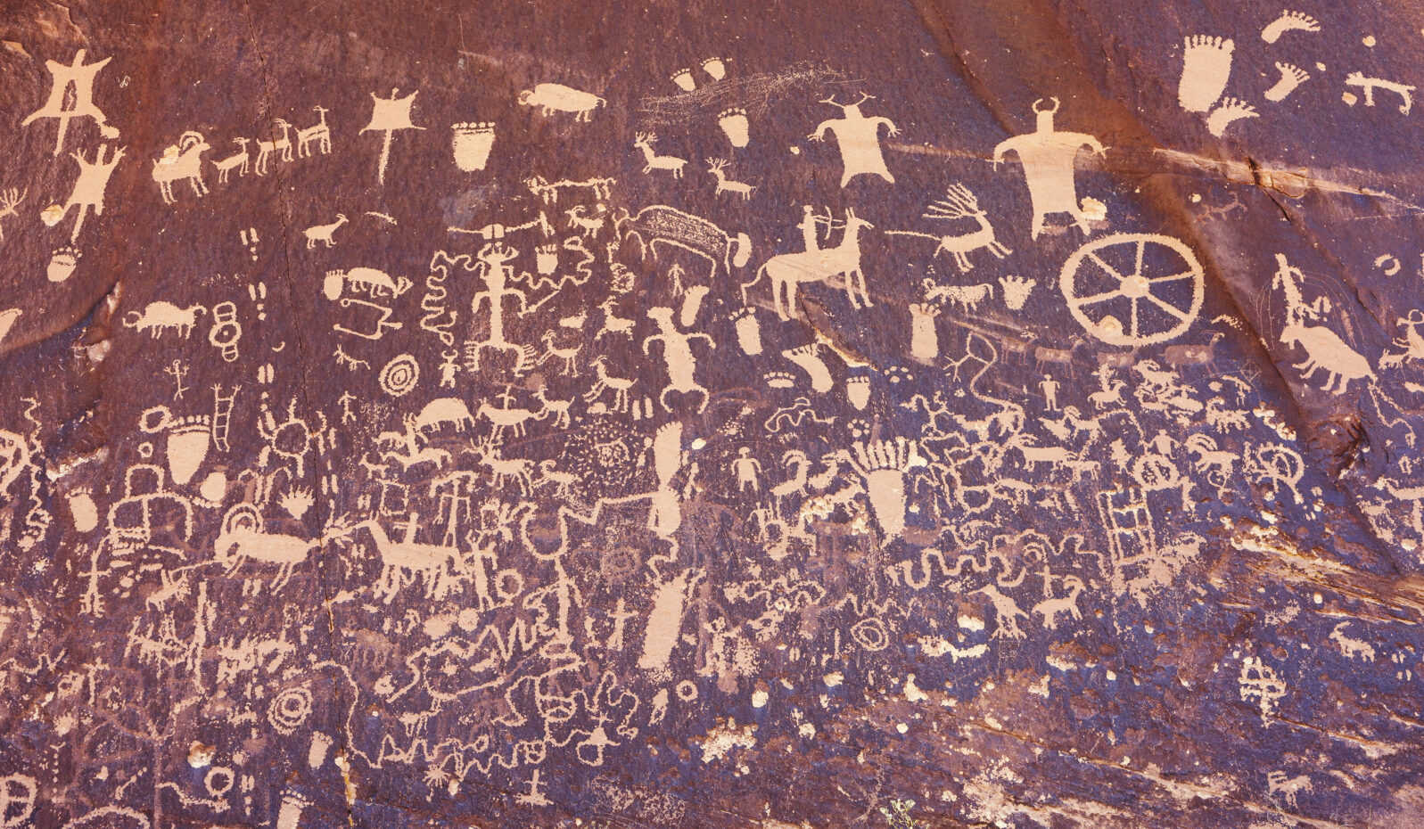 Ancient symbols texture, Petroglyphs on Newspaper Rock, Utah, USA.