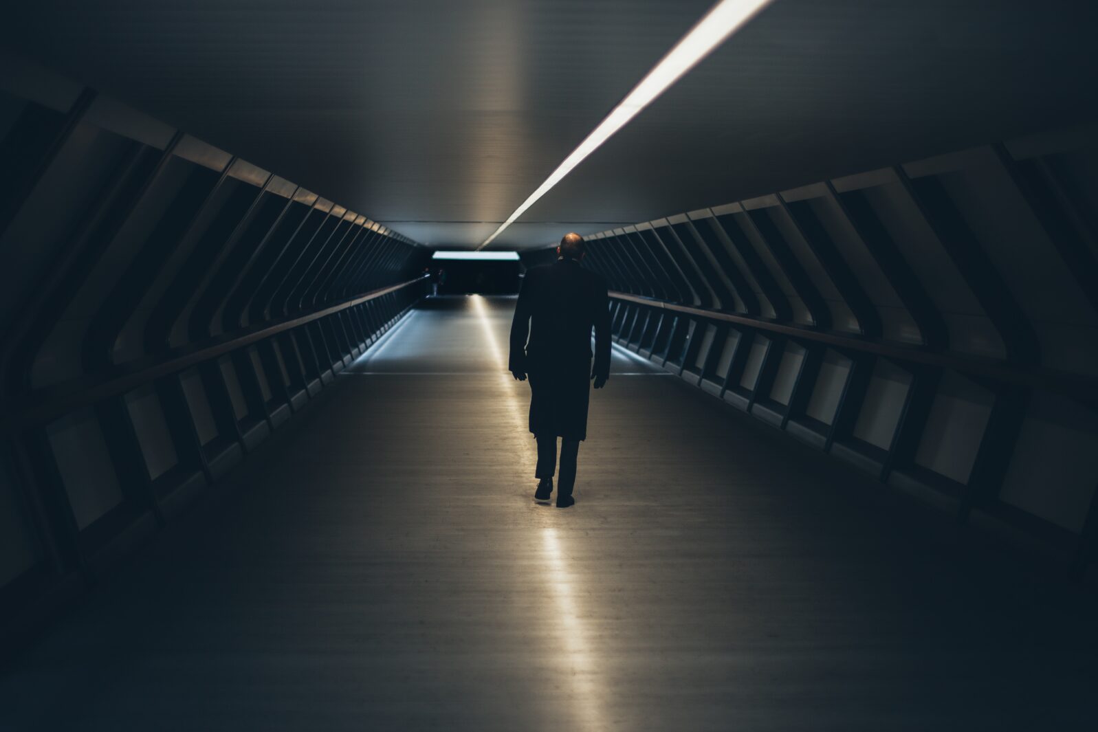 Man walking in tunnel