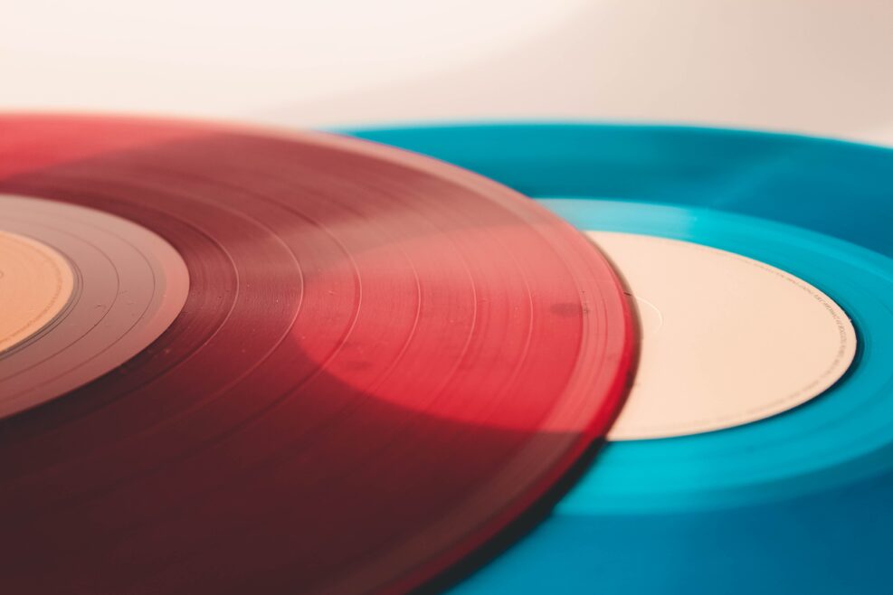 Two tiny records, one red one blue