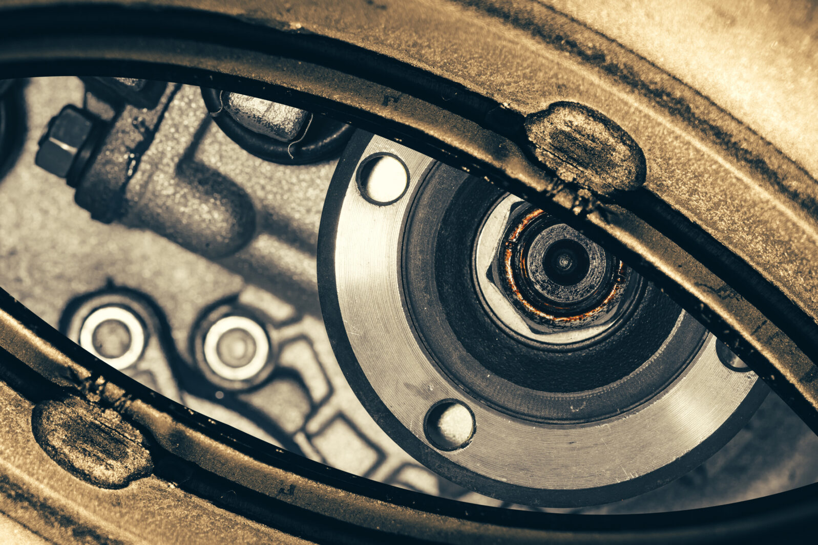 Unusual robotic eye in steampunk style. Focused robot look. Background pattern close-up.