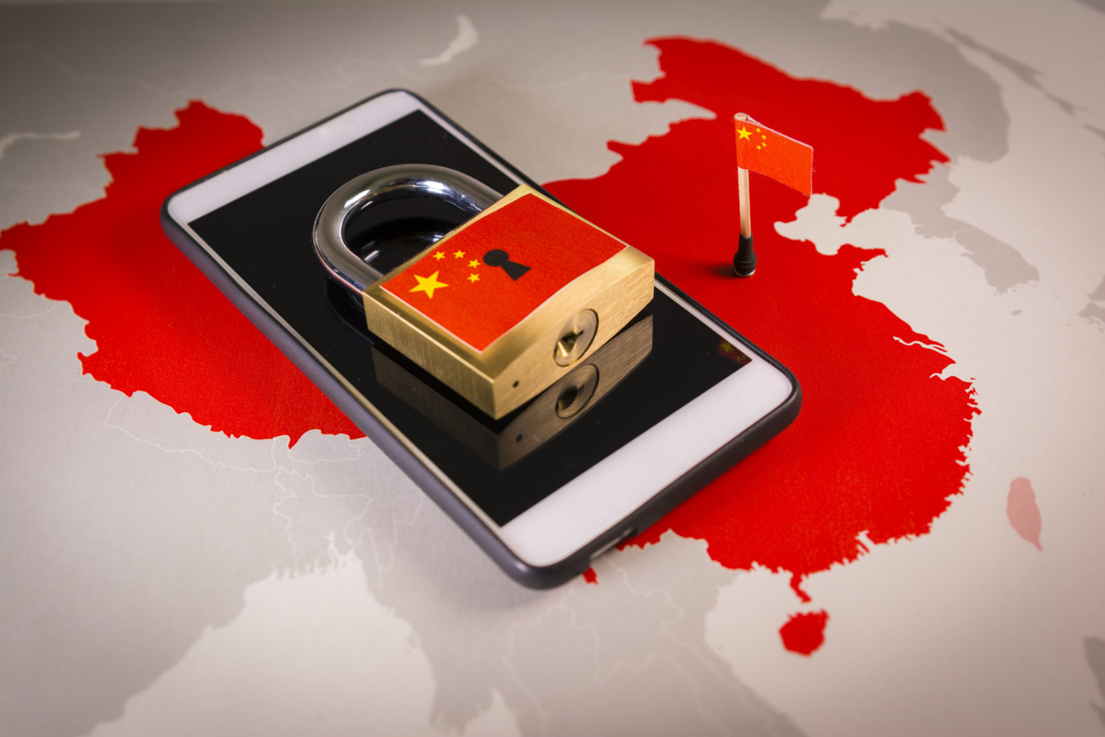 Padlock, China flag on a smartphone and China map, symbolizing the Great Firewall of China concept or GFW and all extreme Internet censorship in China