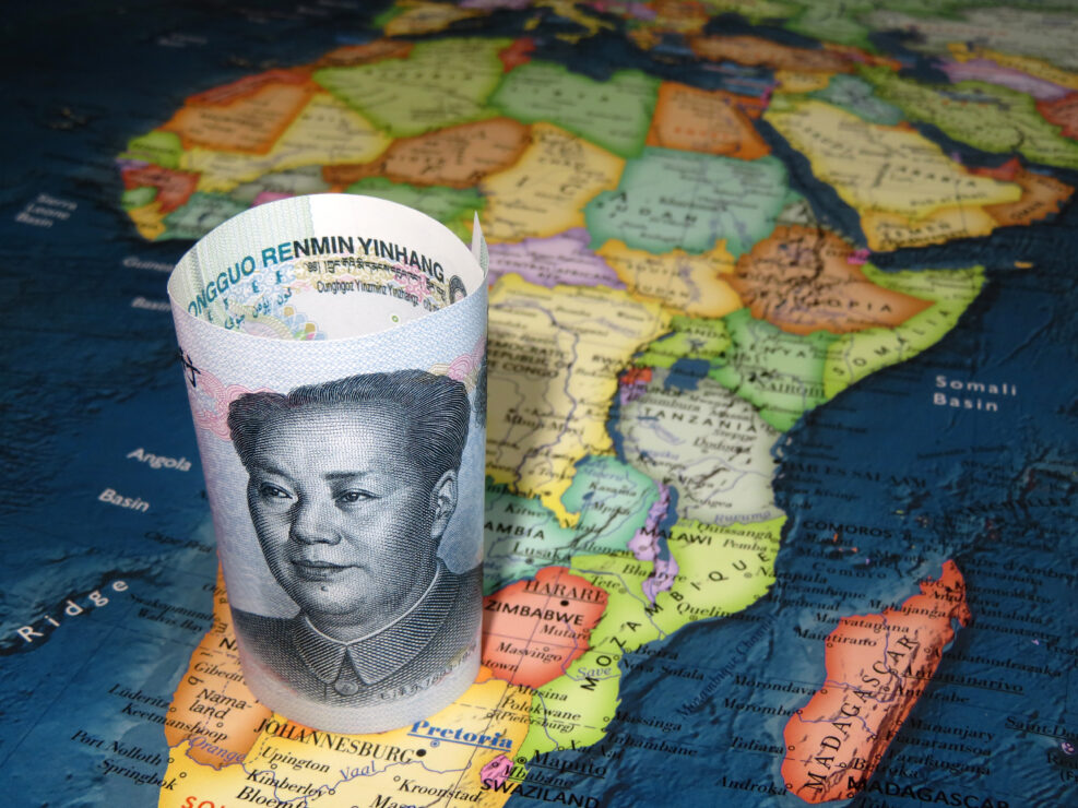 Rolled Yuan bill on the map of Africa. Chinese investment in African economy