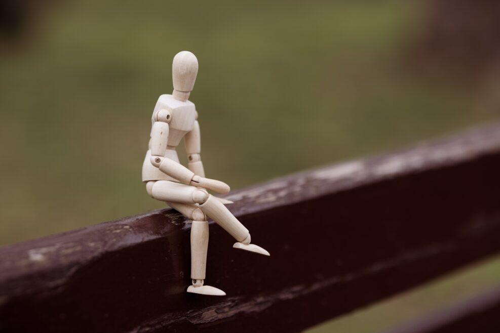 wooden toy model sitting on a bench