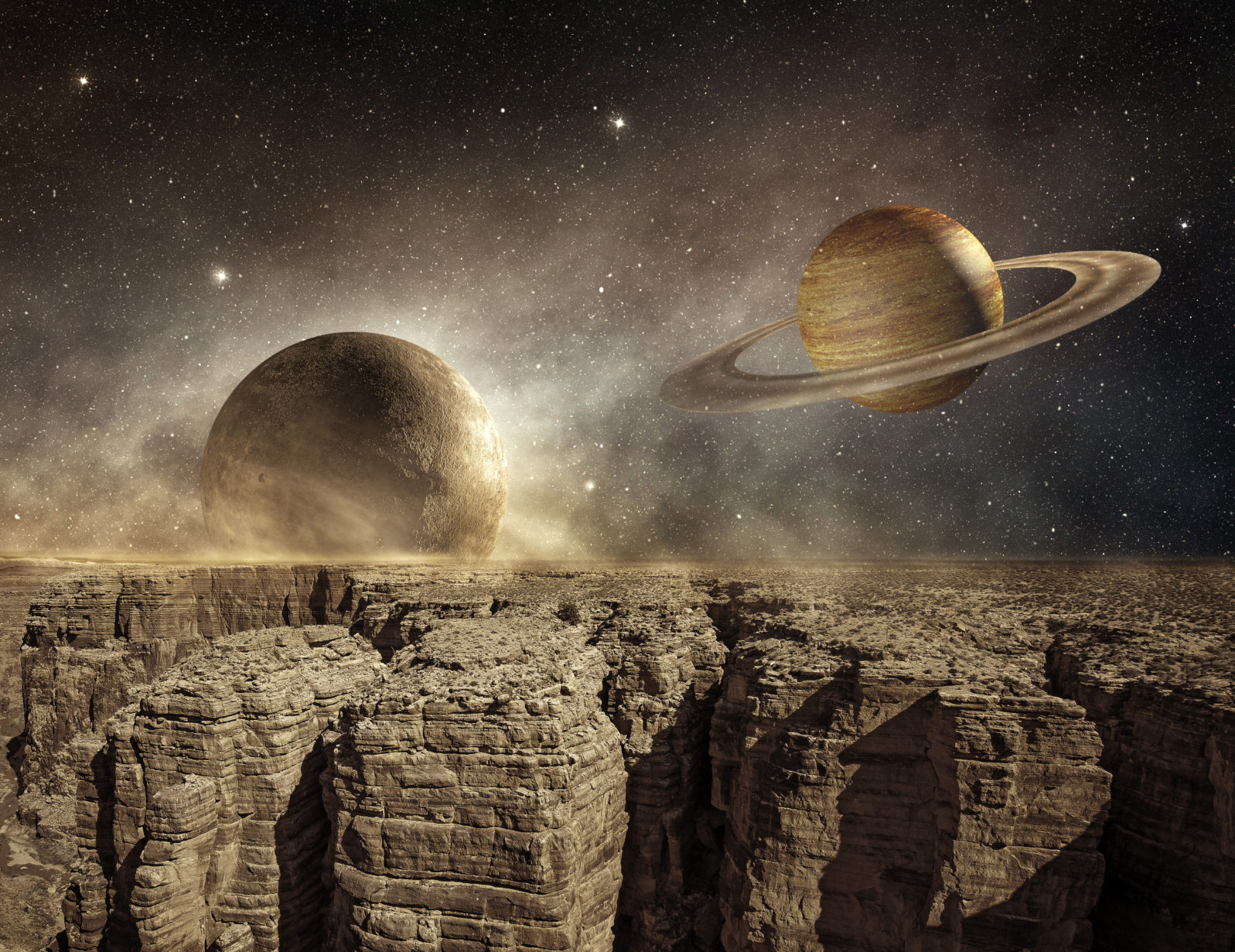 saturn and moon in the sky of a barren landscape