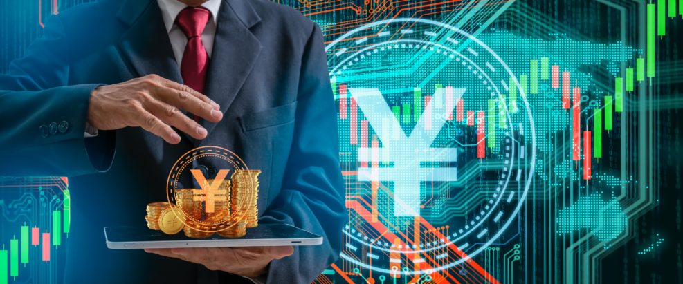 Businessman hand holding tablet and Yuan currency sign on digital map backgroung.Chinese Yuan digital currency and circuit background.Technology digital Financial and china cryptocurrency concept.