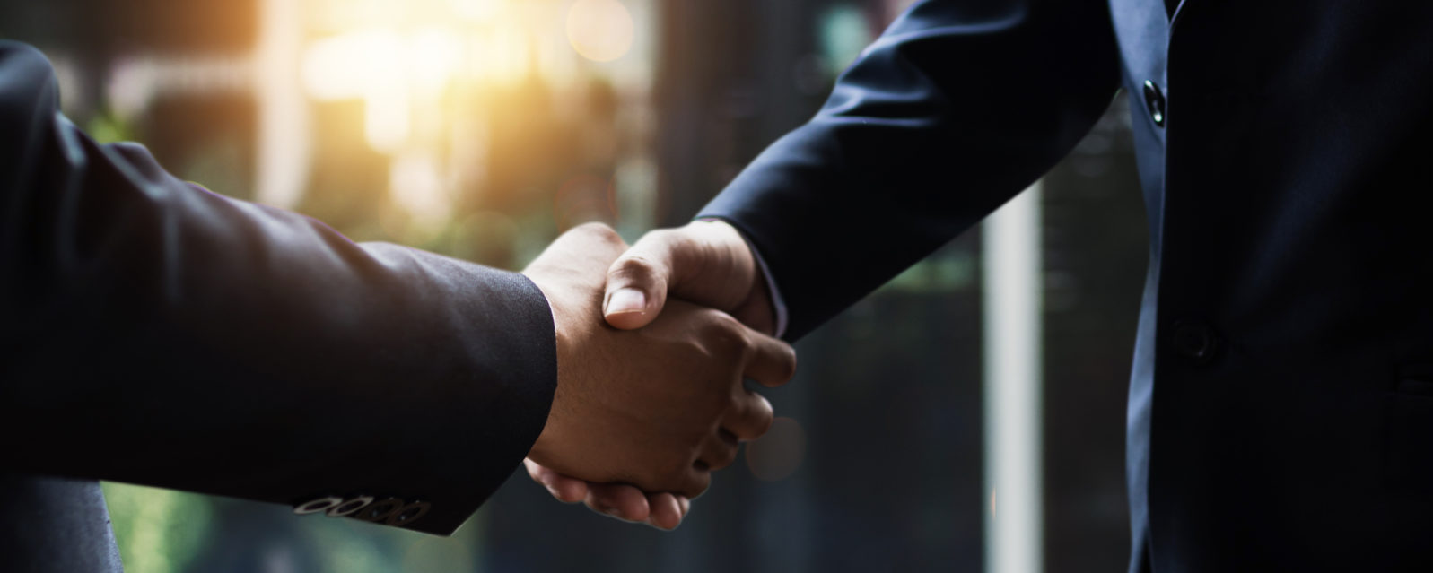 successful negotiate and handshake concept, two businessman shake hand with partner to celebration partnership and teamwork, business deal