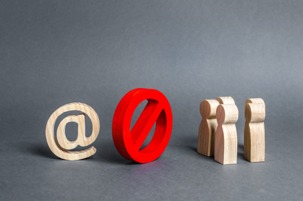 An internet email symbol and a group of people are separated by a red prohibitory symbol No. restrictions on access to the global Internet. Censorship. Information control, society isolation policy