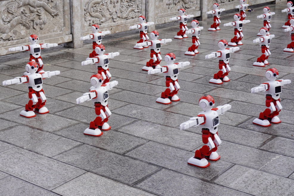 Robots dancing in the park. Artificial intelligence industry in China.