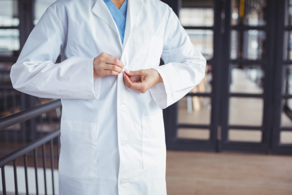 Midsection of doctor wearing lab coat