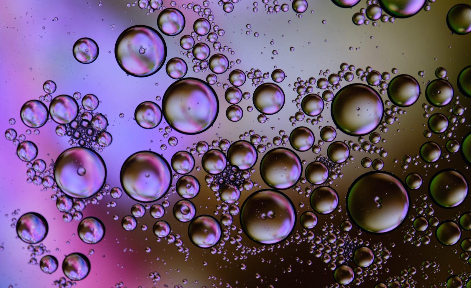 Oil drop on water with illuminated background