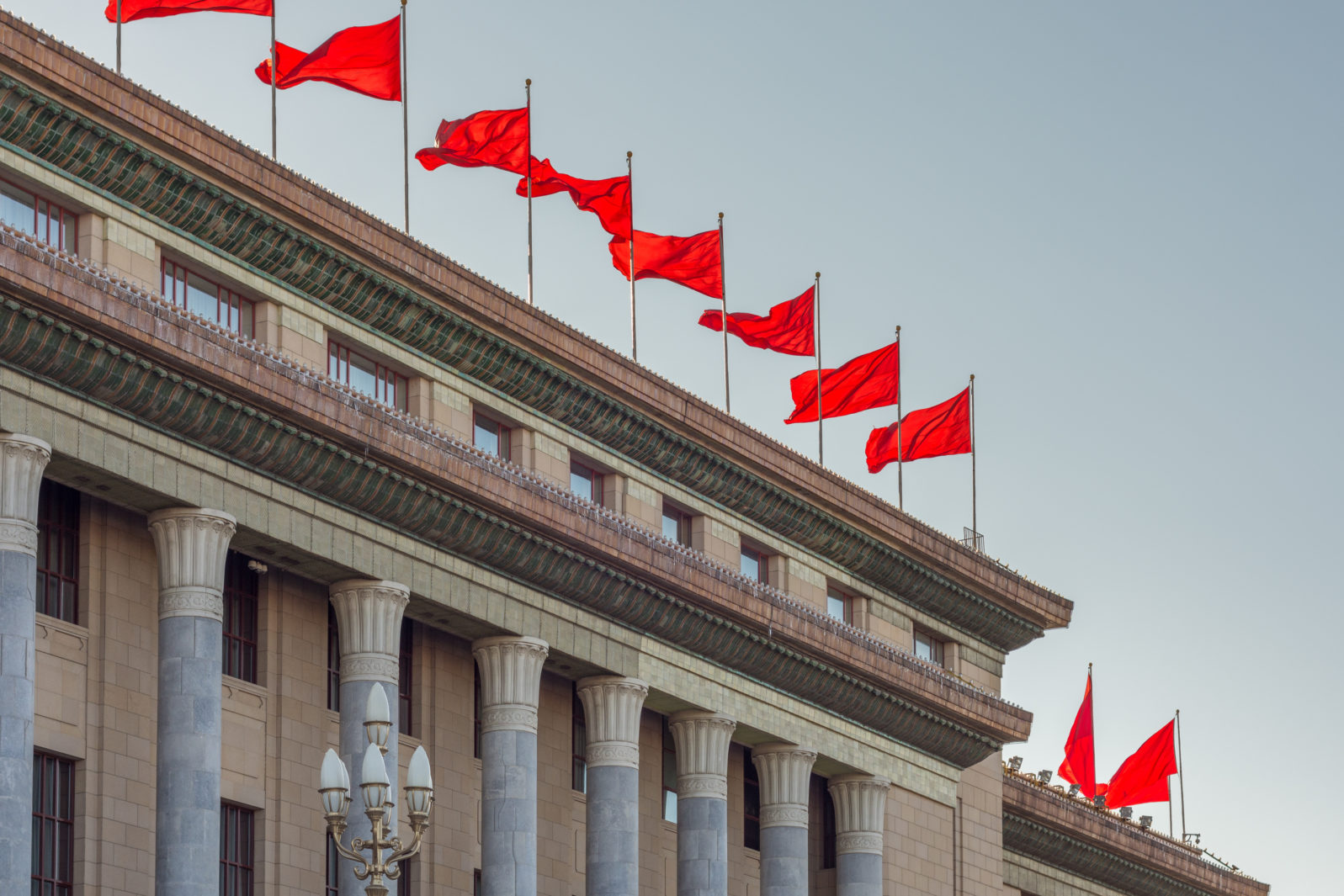 Red banners atop the National People`s Congress in Beijing, China