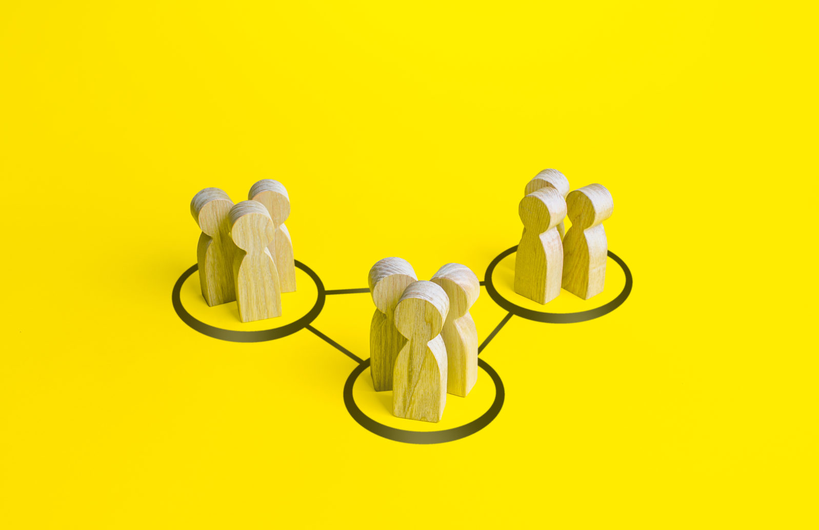 Groups of people are connected by lines. Interdependence correlation in workflow. Interacting and joining forces with other teams. Interact to complete tasks. Formation of a more complex community.