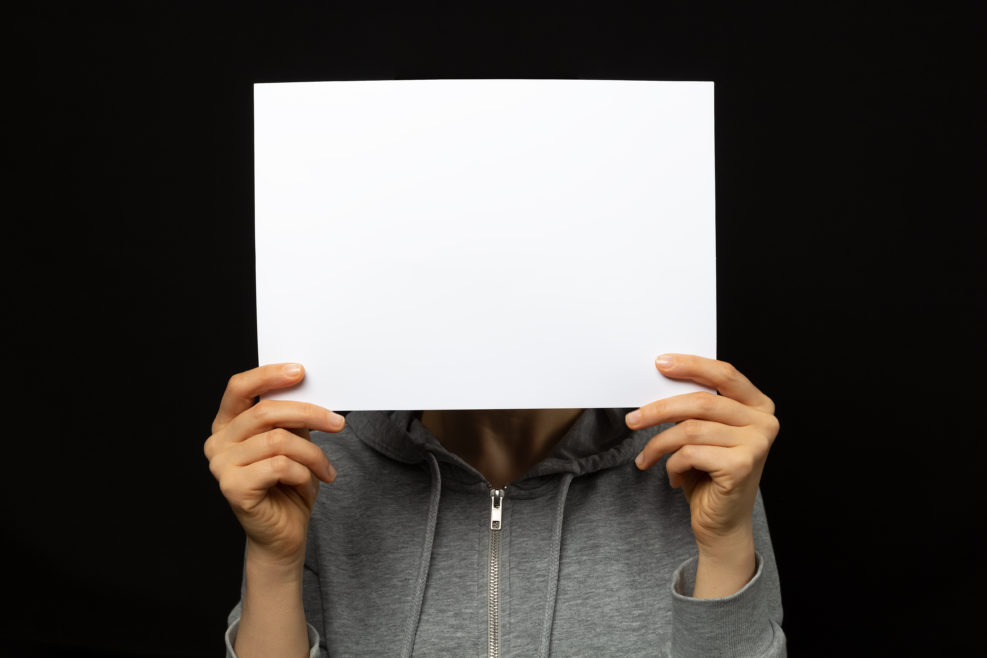 A sheet of white paper is held by a protester in China.