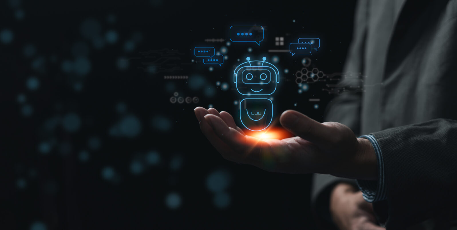Businessman holding a light chatbot hologram intelligence AI. Digital chatbot, chatGPT, robot application.Chat GPT chat with AI Artifice intelligent developers digital technology concept.