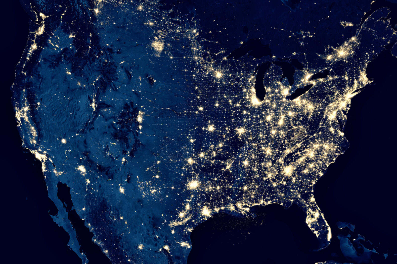 Earth at night, view of city lights in United States from space. USA on world map on global satellite photo. US terrain on dark planet.