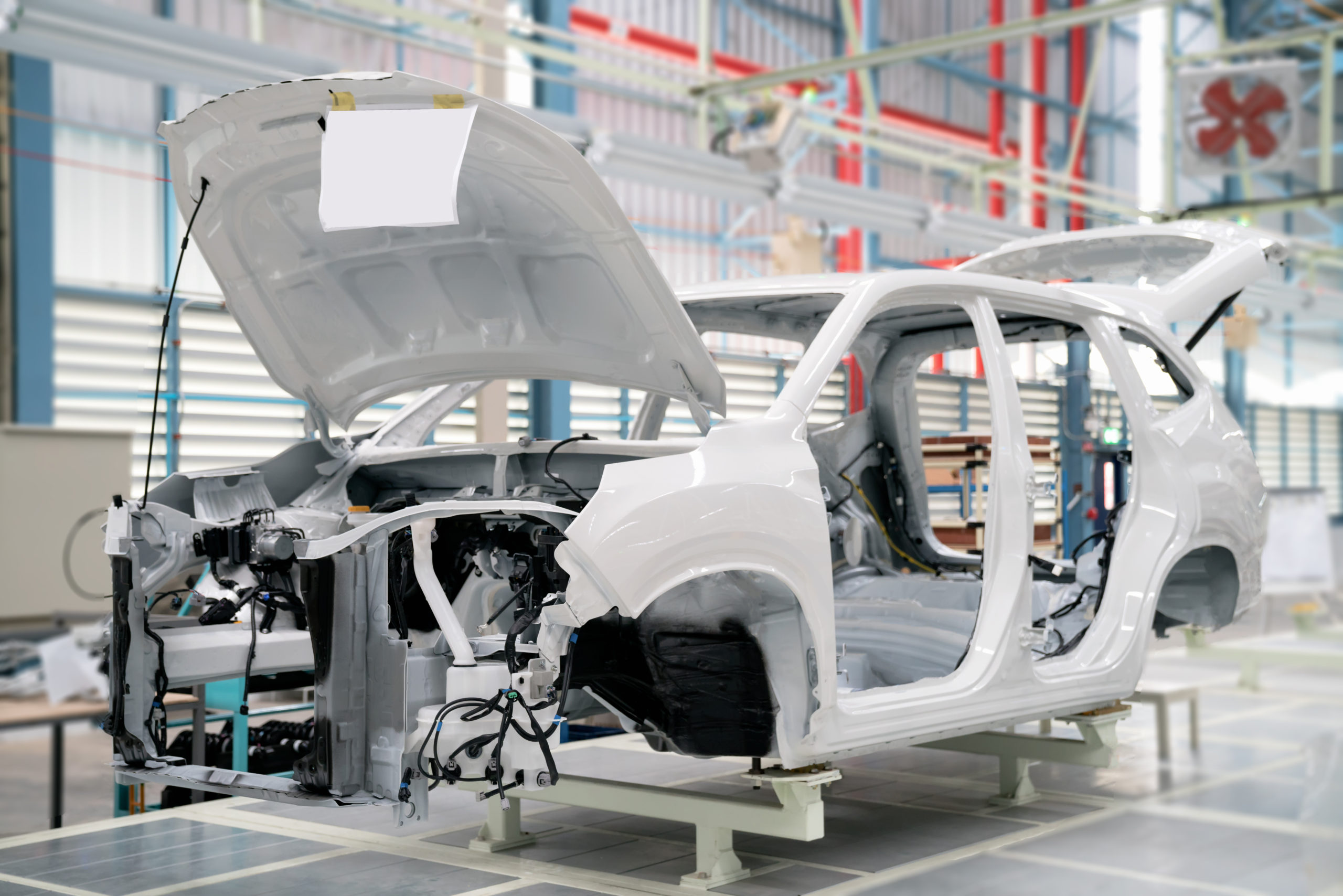 Car frame with unfinished assembly in the production line of  the automobile enterprise
