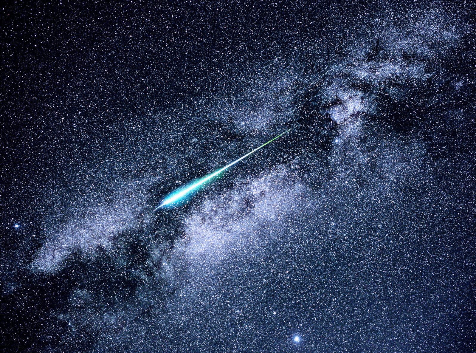 A meteor streaks across the Milky Way during the Perseid meteor shower of 2016.