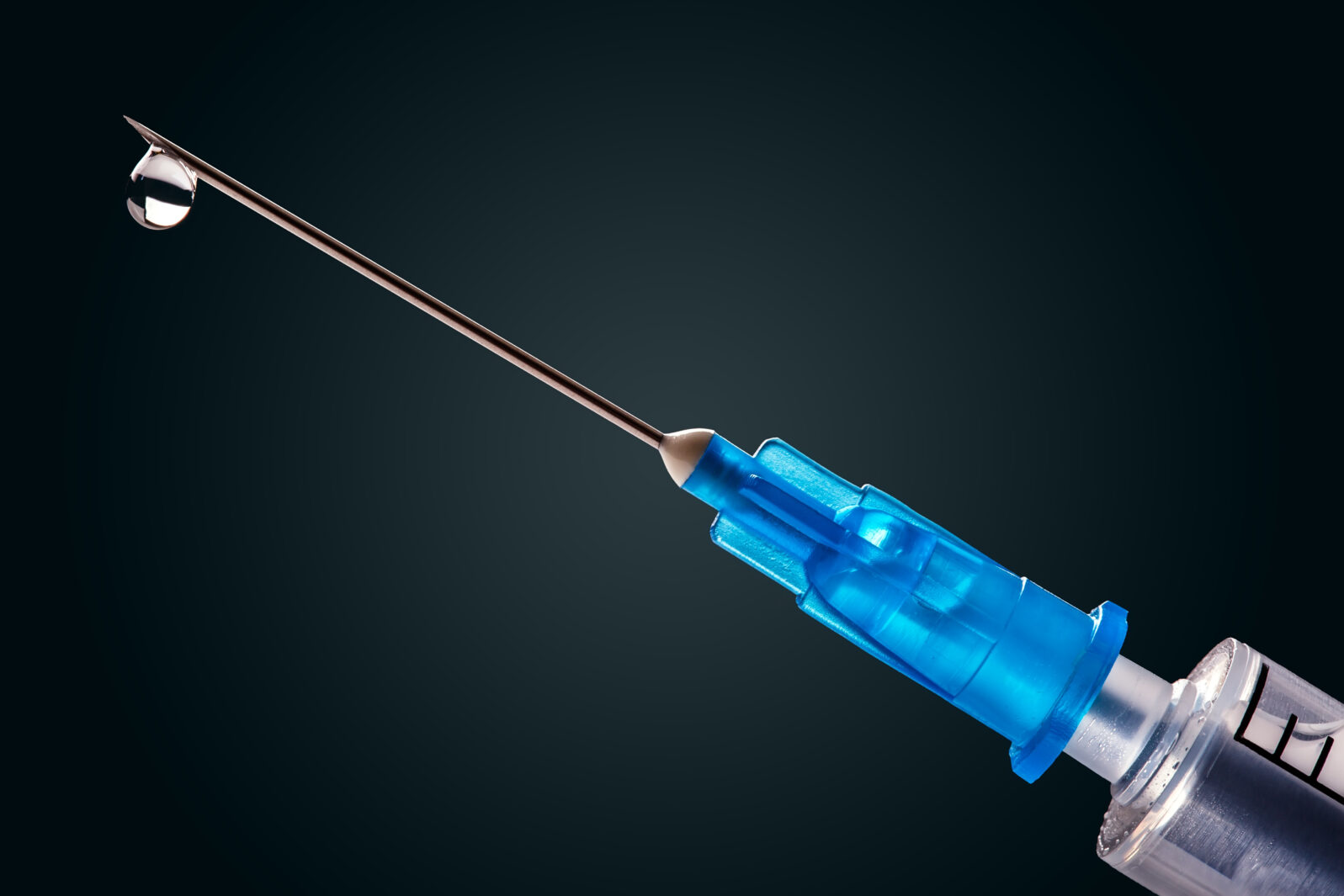 Medical syringe with a needle at the end of the drop