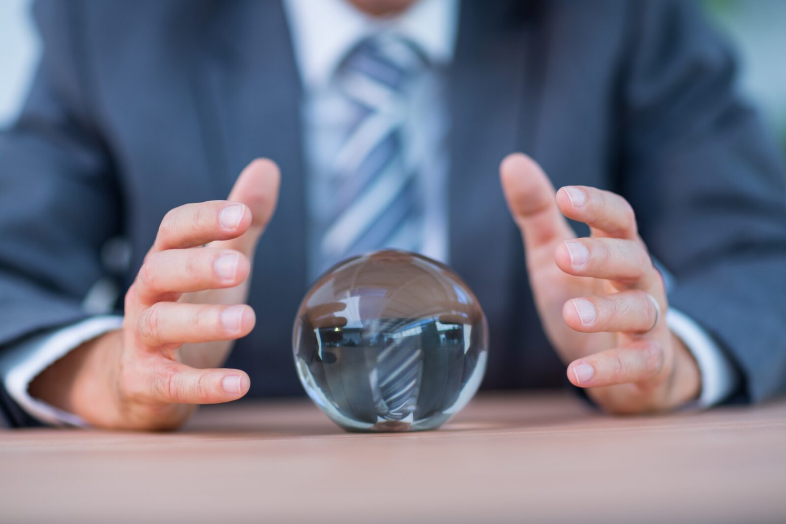 Businessman forecasting a crystal ball