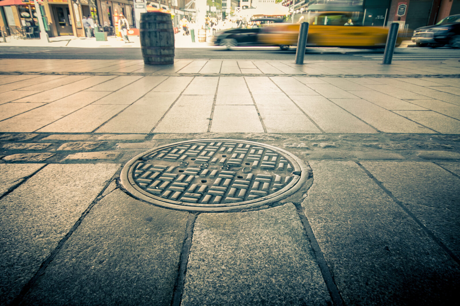 Manhole drain cover on streets of lower Manhattan