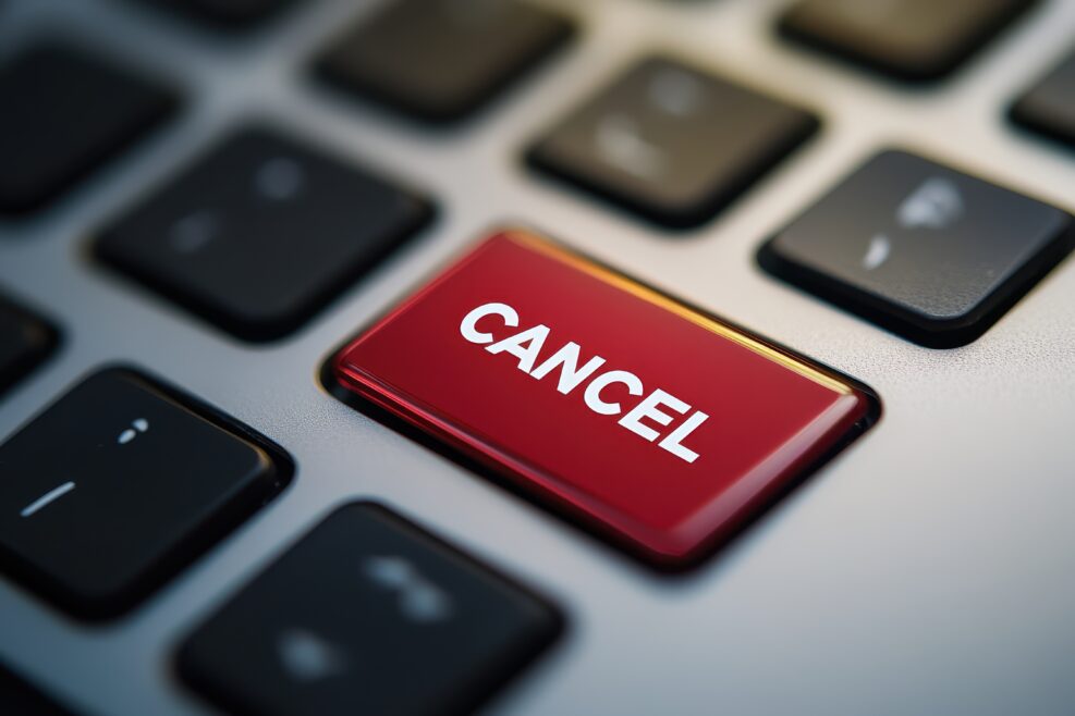 Cancel word on a red enter key of the black pc keyboard. Concepts of cancel culture, ostracism and call-out culture social media and in the Internet. Computer enter key with message.