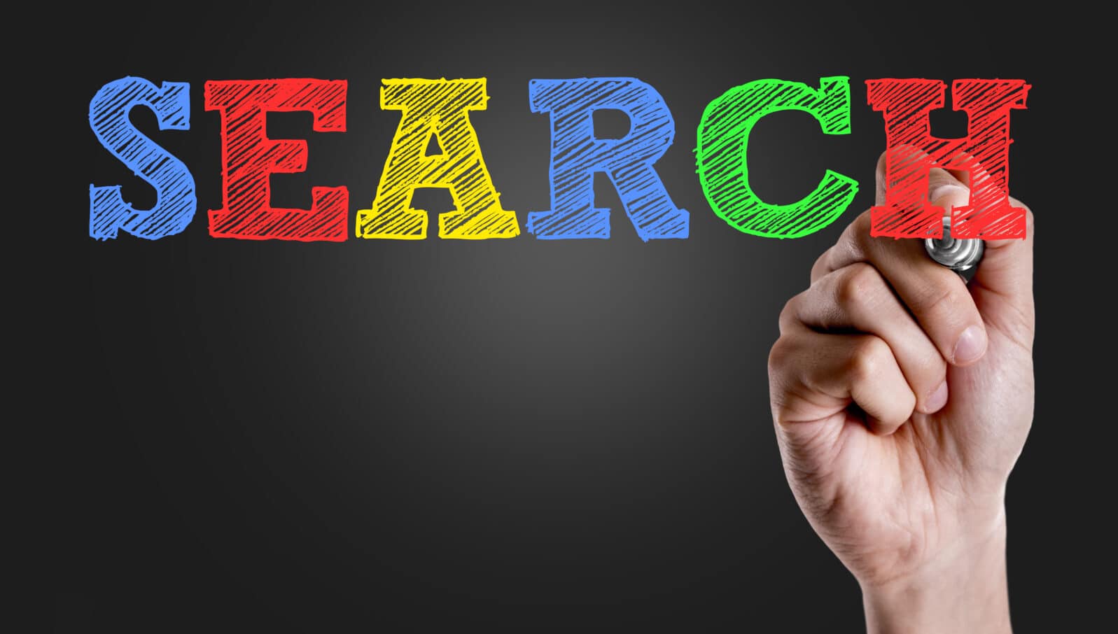 Hand writing the text: Search