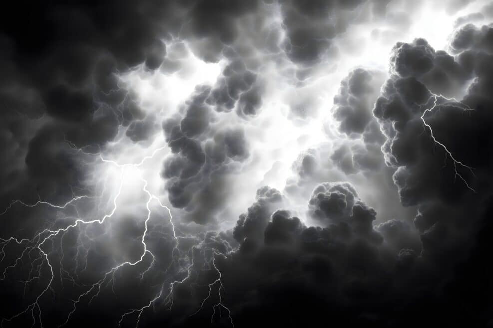 Intense lightning storm over dark clouds nature image atmospheric dramatic weather phenomenon