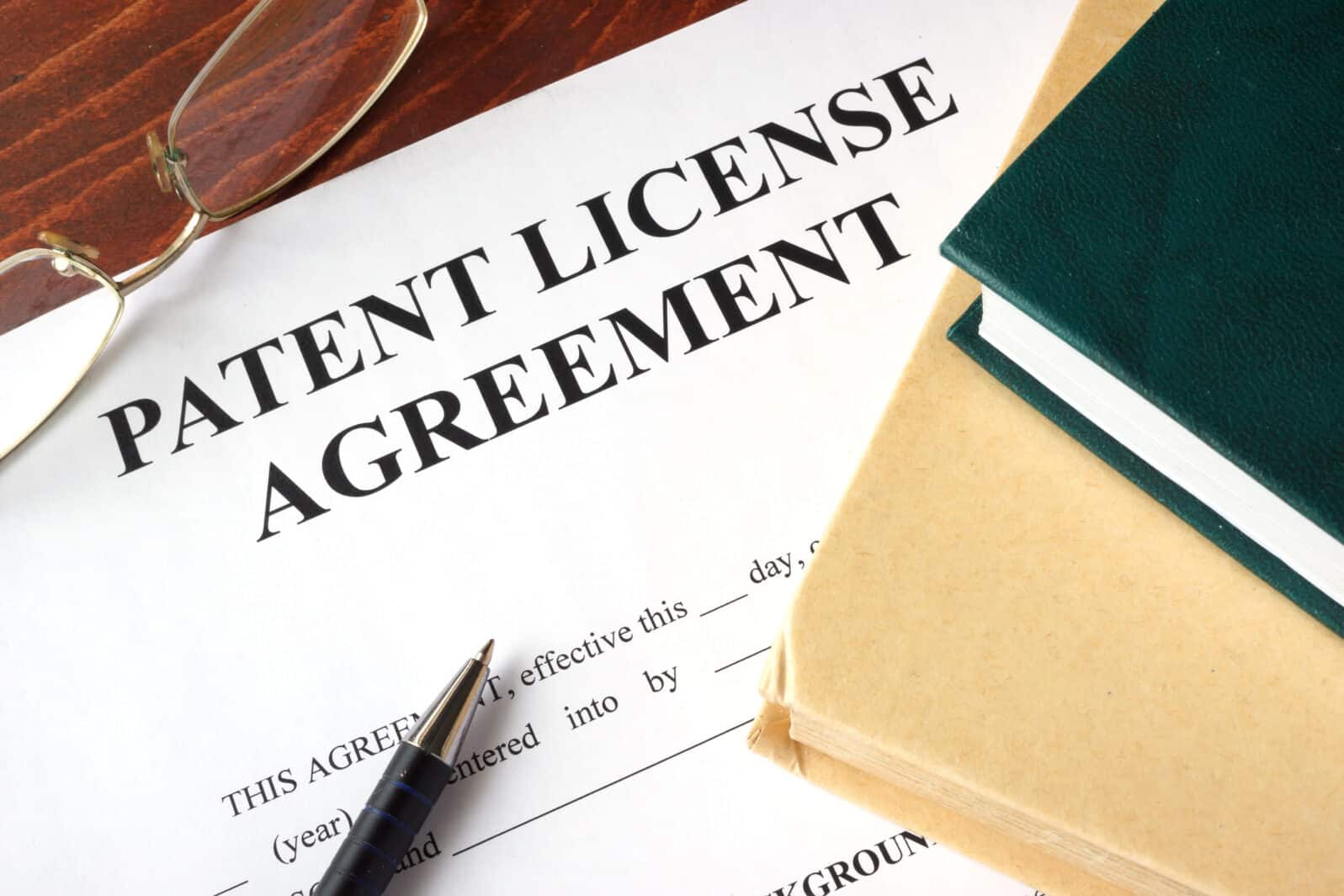 Patent License agreement on a table. Copyright concept.