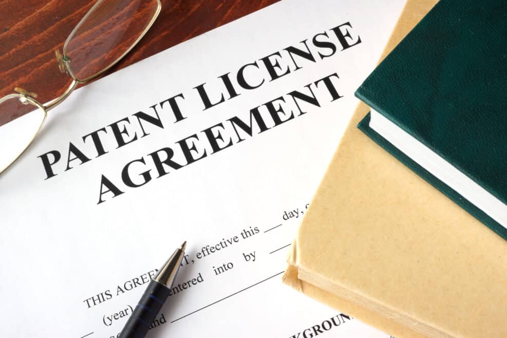 Patent License agreement on a table. Copyright concept.