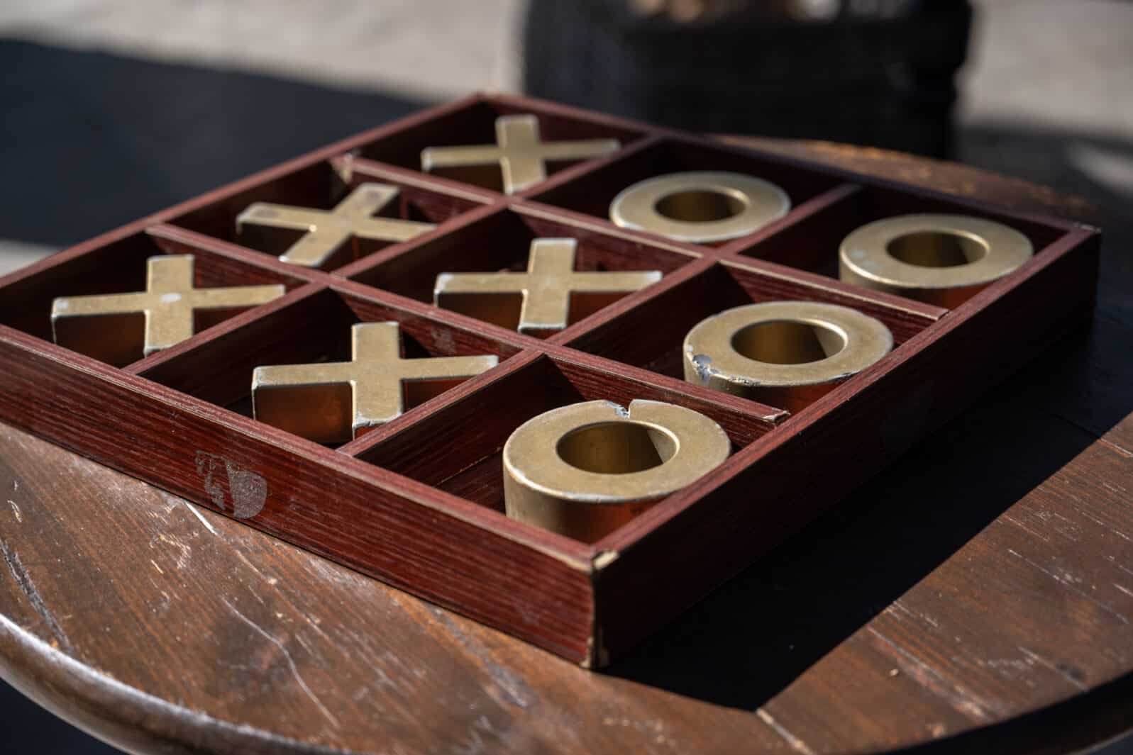 Table games of chance, including tic tac toe, are set up in large size to entertain the party guests