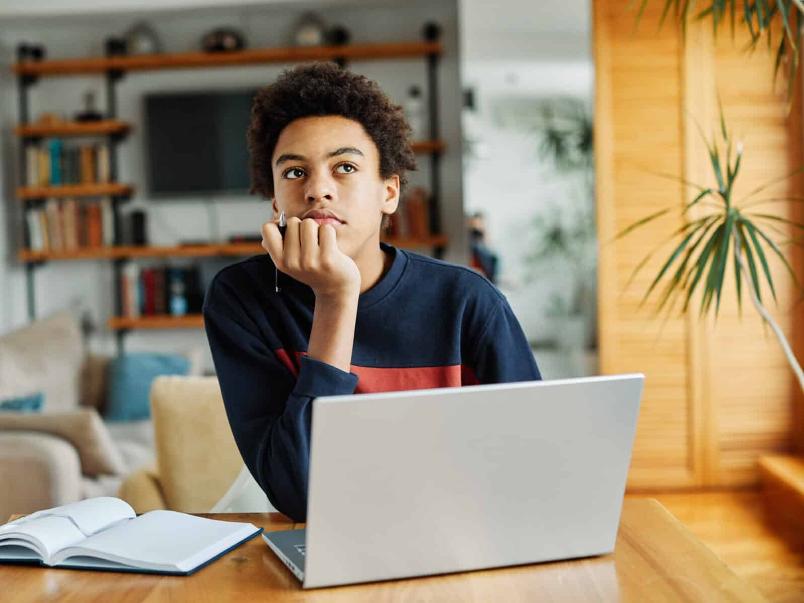 education laptop student teenager studying boy learning homework idea thinking dreaming student thoughtful looking education inspiration study young school