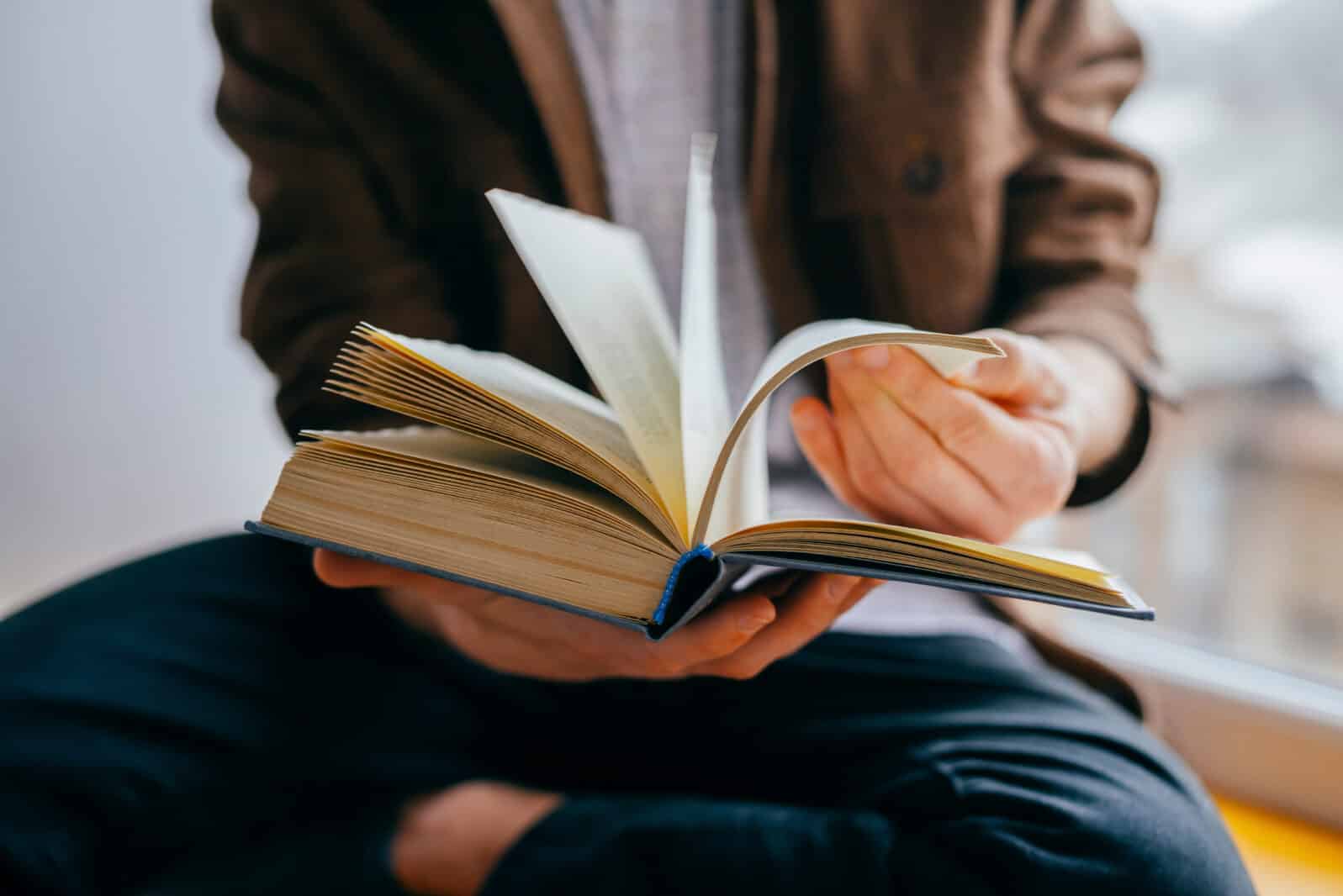 Young man reading a book
