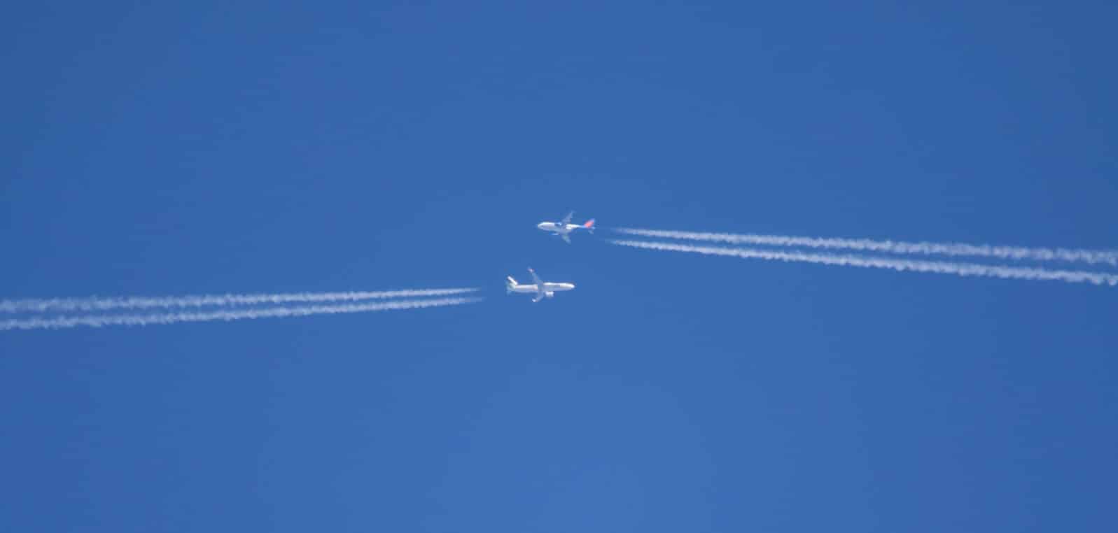 Two Commercial Airliners Pass Each Other at High Altitude
