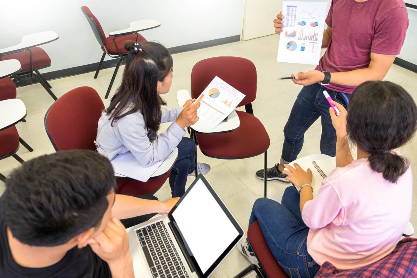 Adult students group listen to professor's lecture and Asking Question in small class room On University Campus