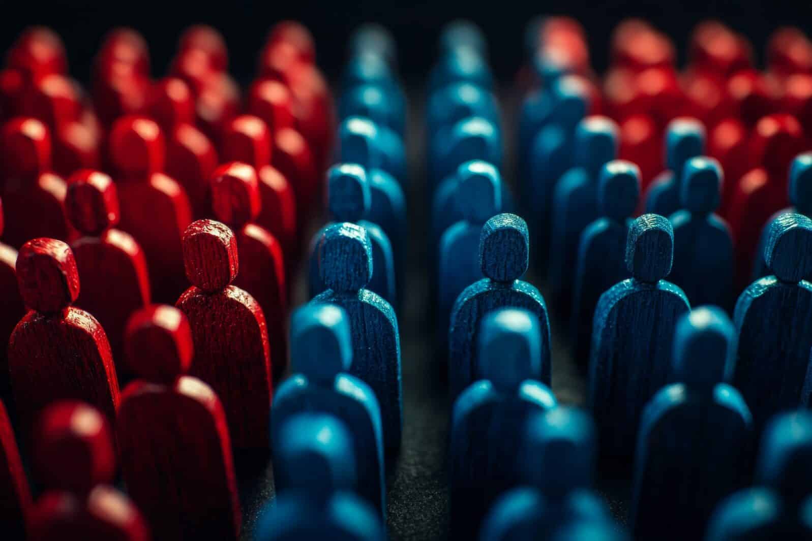 Red and blue wooden figures facing each other in contrast, representing the opposing sides in American politics or ideologies.