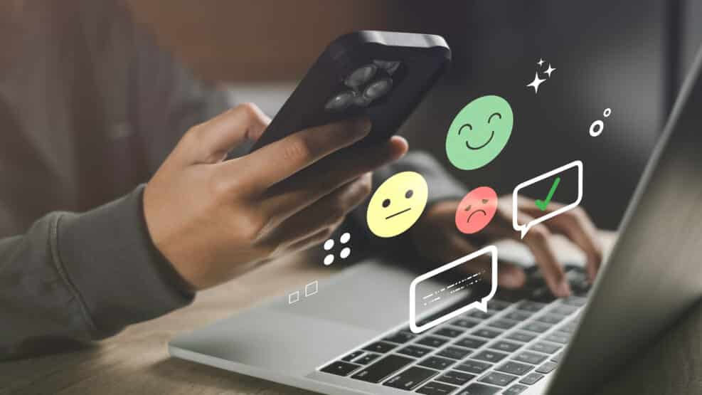 Sentiment analysis and opinion mining concept with emoji faces and digital feedback icons on a laptop and smartphone, representing customer emotions, online review analysis, User experience insights.